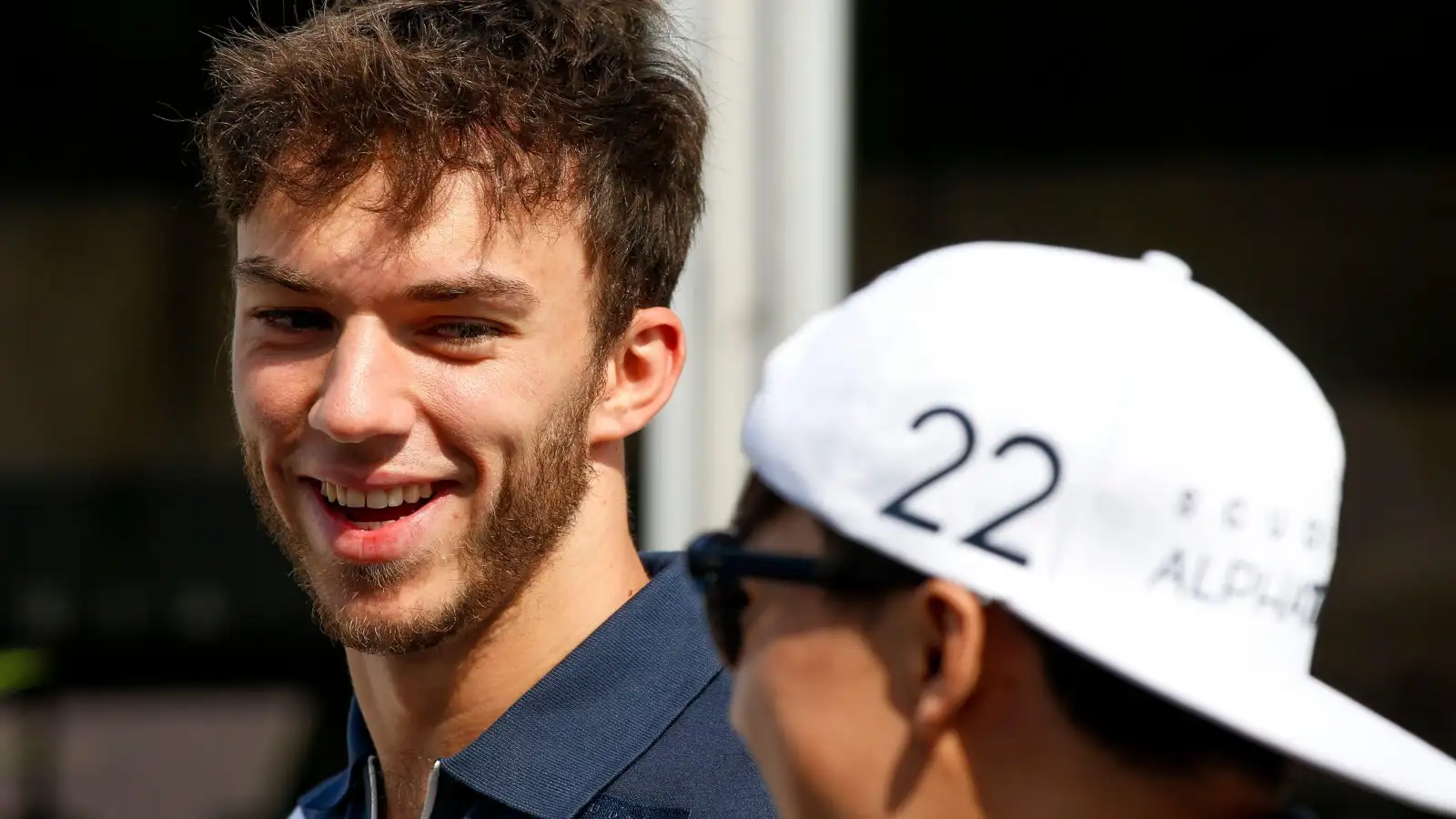 Pierre Gasly and Yuki Tsunoda, AlphaTauri, smiling. Qatar, November 2021.