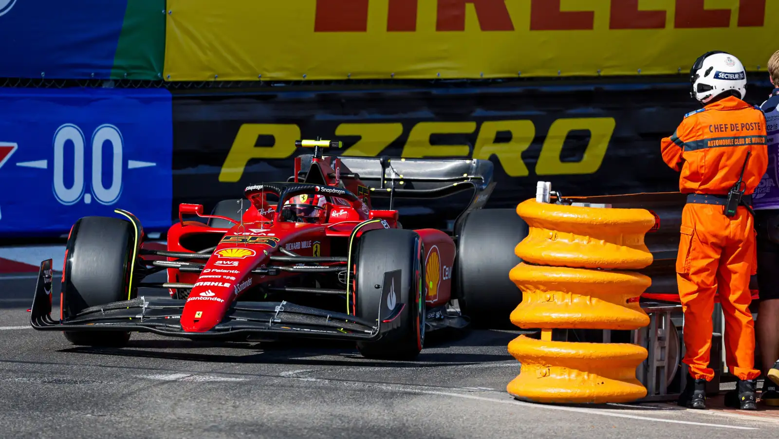 Carlos Sainz drives past the barriers and marshals. Monaco May 2022