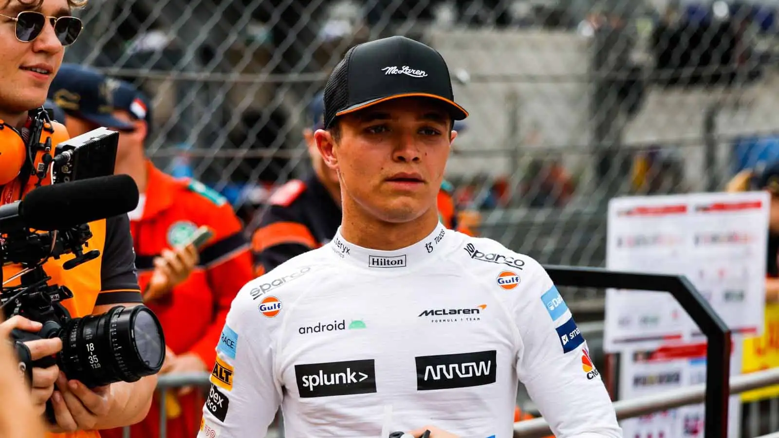 Lando Norris walks in the pit lane. Monaco May 2022.