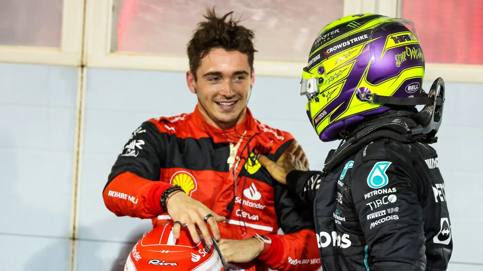 Lewis Hamilton pats Charles Leclerc on the arm as he congratulates him. Bahrain March 2022