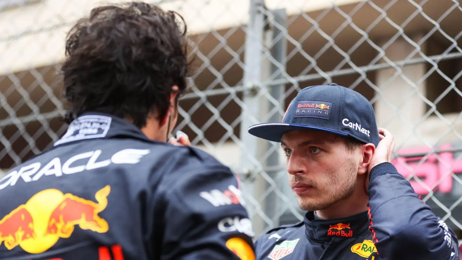 Sergio Perez and Max Verstappen speaking. Monaco, May 2022.