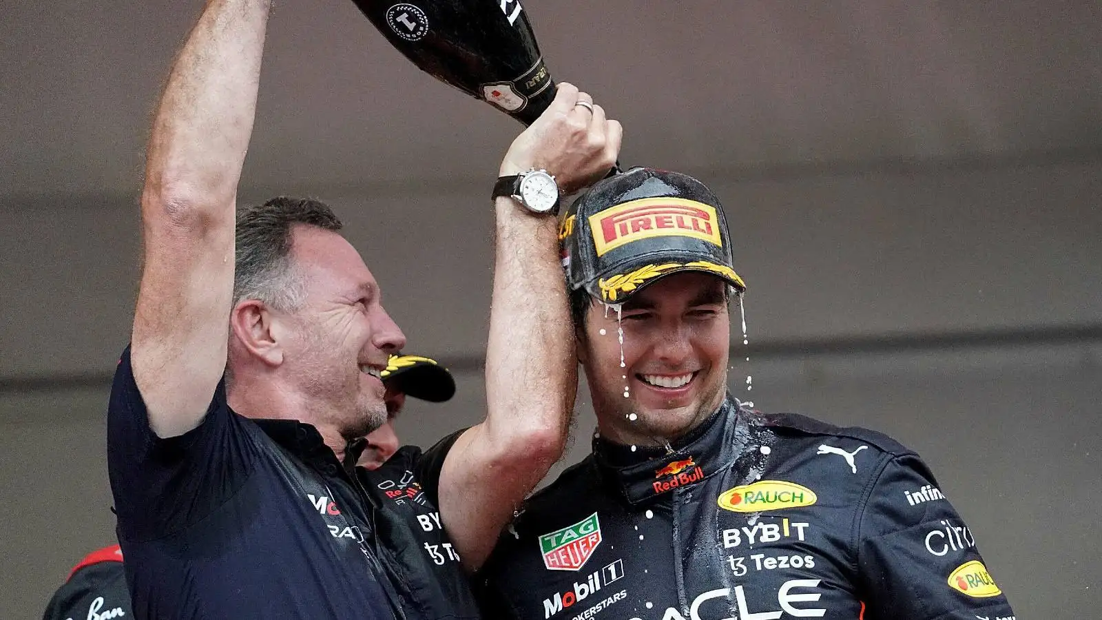 Christian Horner pours champagne on Sergio Perez . Monaco, May 2022.