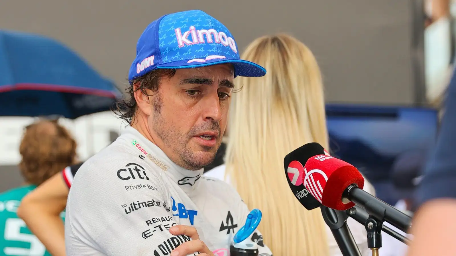 Fernando Alonso speaks into a microphone. Monaco, May 2022.