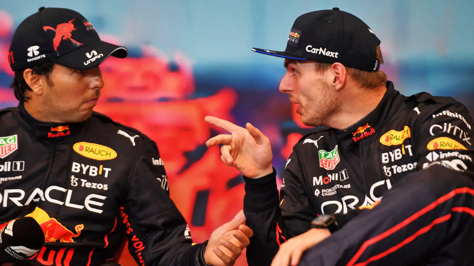 Red Bull's Sergio Perez and Max Verstappen in discussion at the Monaco Grand Prix. Monte Carlo, May 2022.