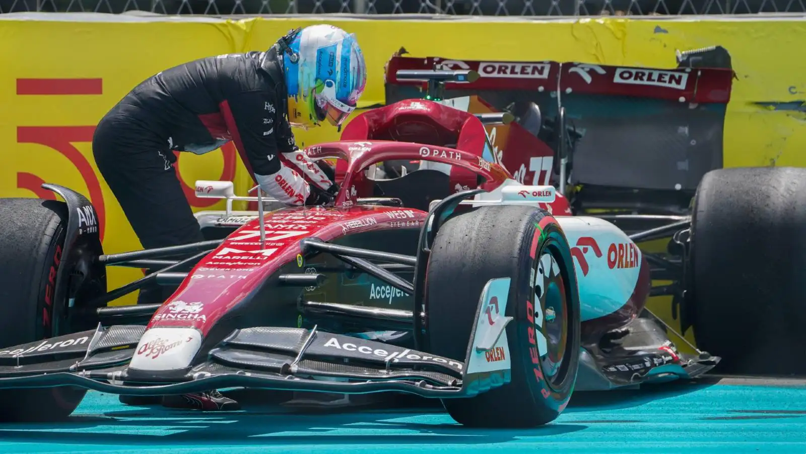 Valtteri Bottas stands next to his Alfa Romeo. Miami May 2022.