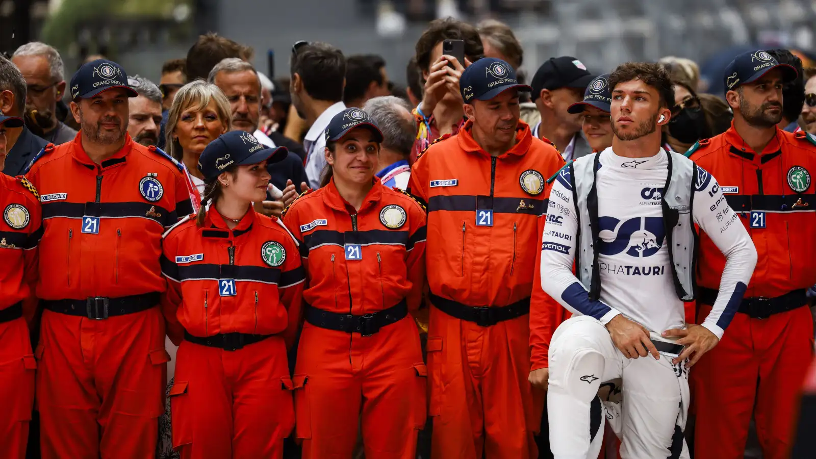 Pierre Gasly standing with the Monaco marshals. Monaco May 2022