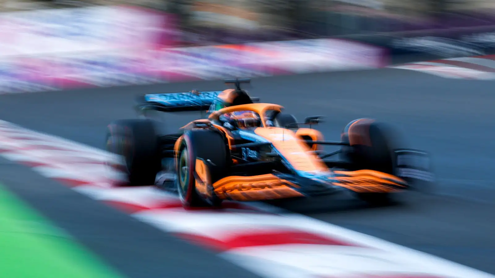 Daniel Ricciardo blurred in his McLaren. Baku June 2022