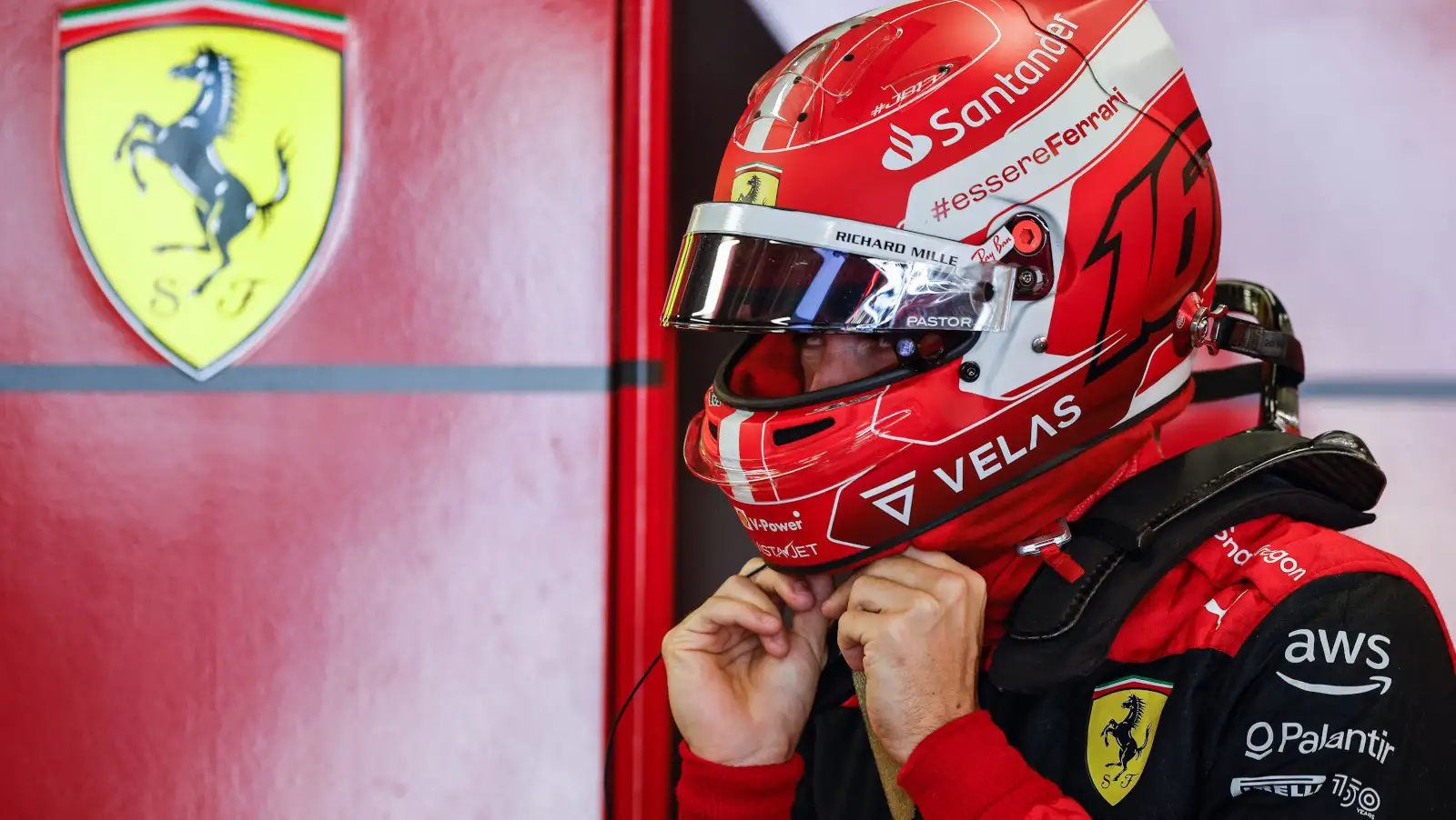 Charles Leclerc undoing the straps of his helmet. Baku June 2022