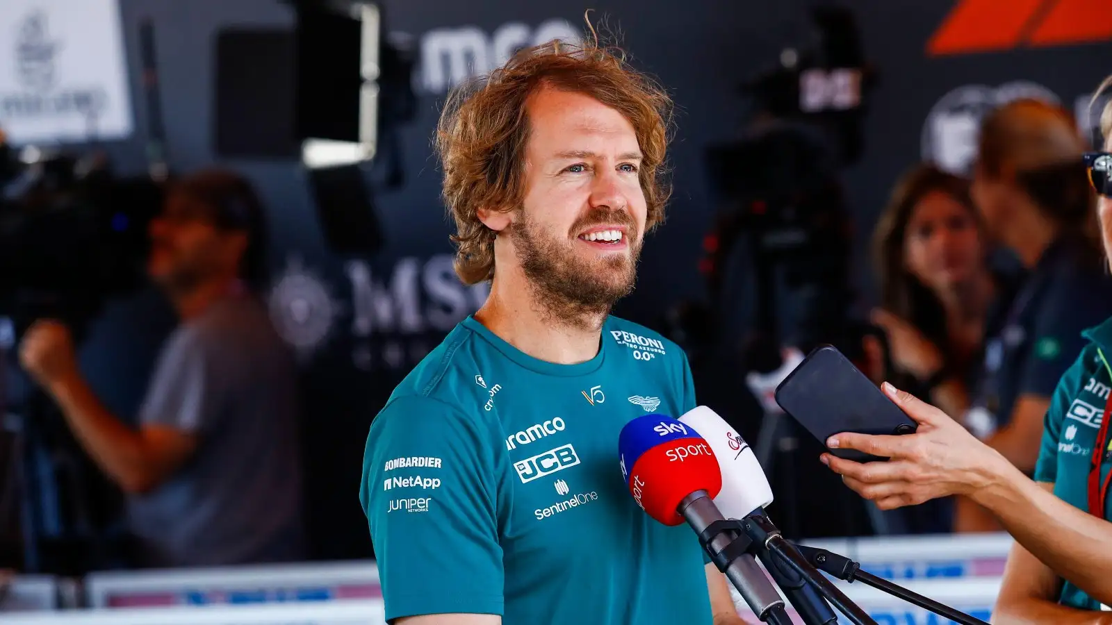 Sebastian Vettel smiles whilst answering a question. Baku, June 2022.