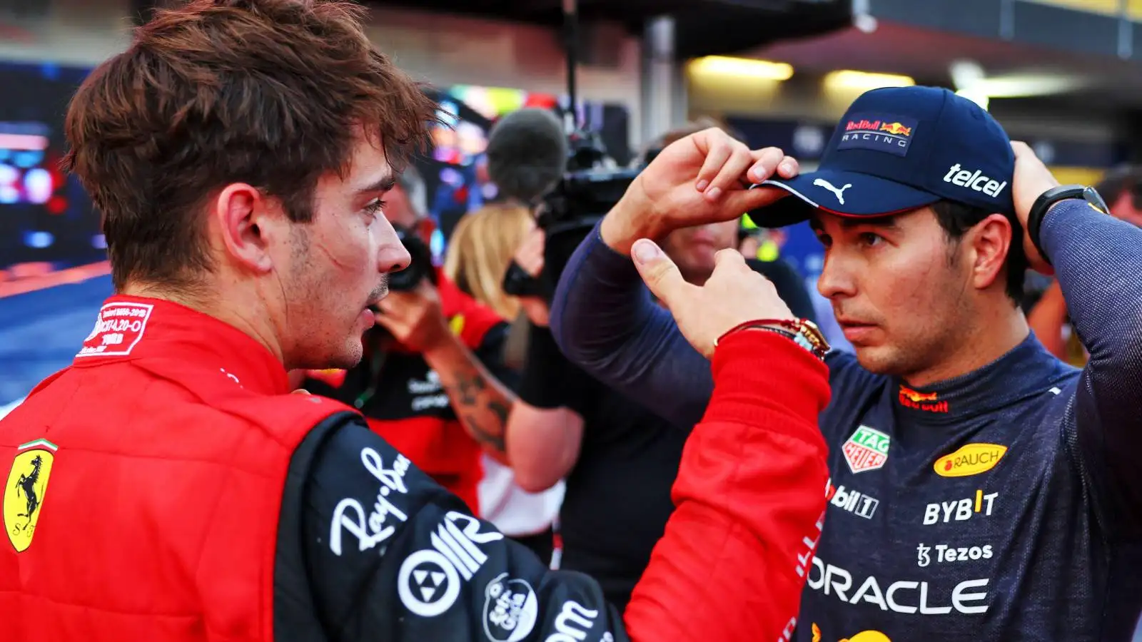 Charles Leclerc, Ferrari, and Sergio Perez, Red Bull, talk after qualifying. Azerbaijan, June 2022.