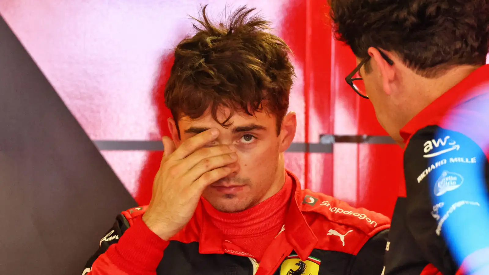 Mattia Binotto speaking with Charles Leclerc at the back of the garage. Monaco May 2022