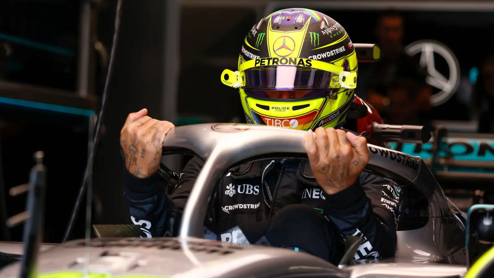Lewis Hamilton holds onto Halo as he climbs out of his W13. Montreal June 2022