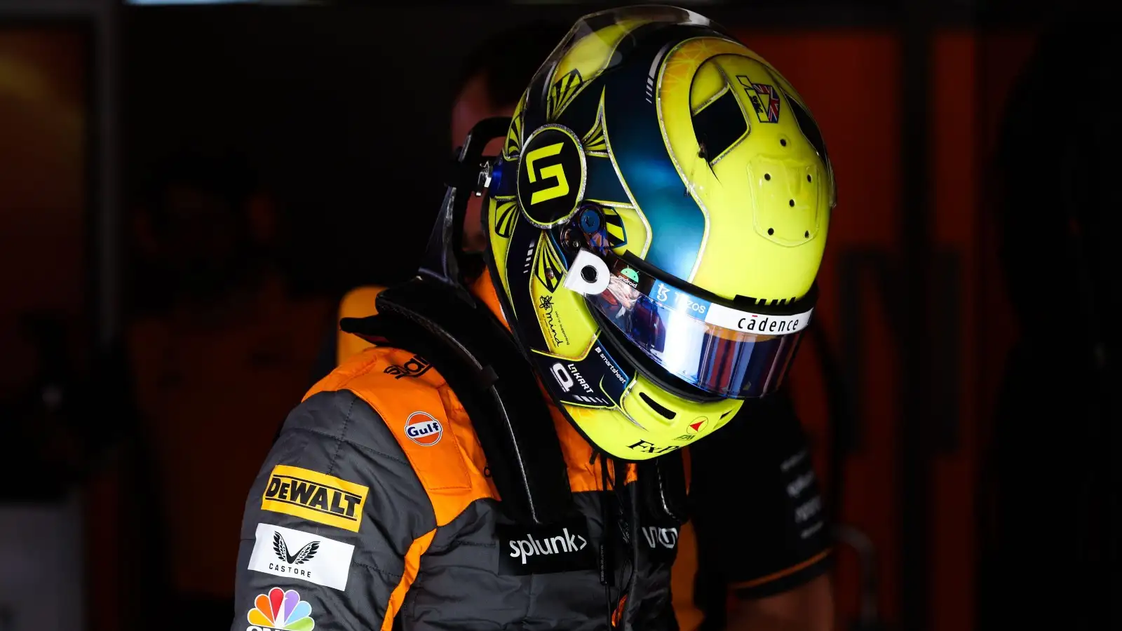 Lando Norris wears his race gear in the McLaren garage. Canada, June 2022.
