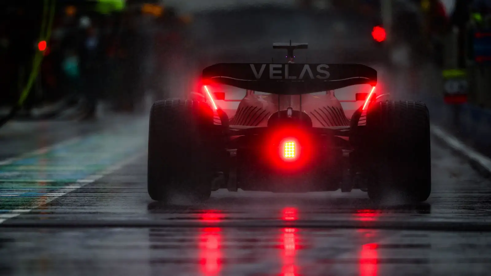 Charles Leclerc drives down a wet Circuit Gilles Villeneuve pit lane. Canada June 2022