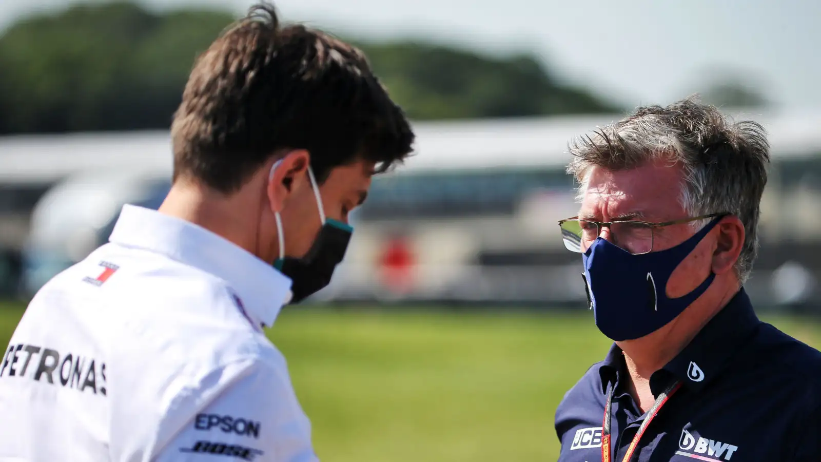Otmar Szafnauer, then of Racing Point, speaks with Mercedes' Toto Wolff. Britain July 2020