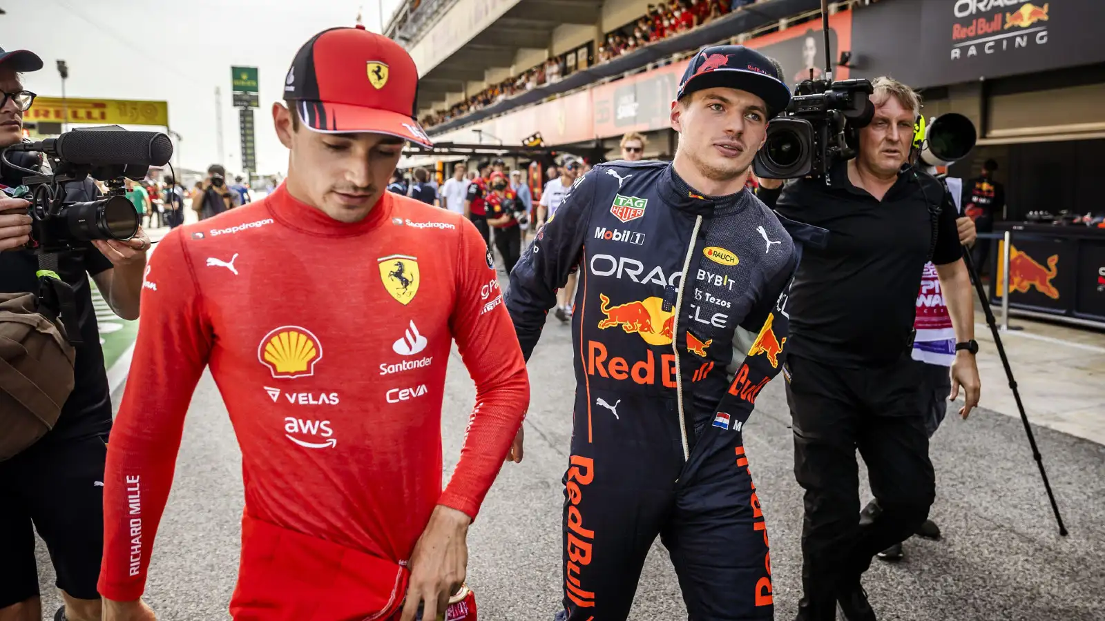 Red Bull driver Max Verstappen and Ferrari driver Charles Leclerc walking together in the Barcelona pitlane. Barcelona, May 2022.