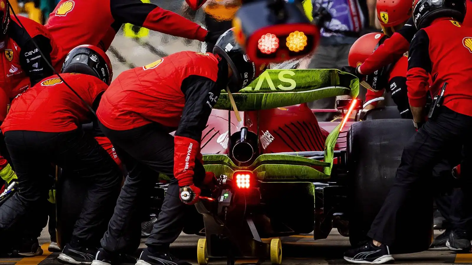 Mechanics work on the Ferrari of Charles Leclerc. England, July 2022.