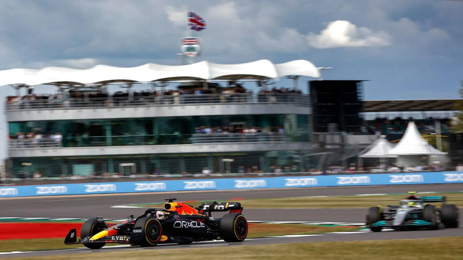 Max Verstappen's Red Bull ahead of a Mercedes at the British GP. Silverstone July 2022.