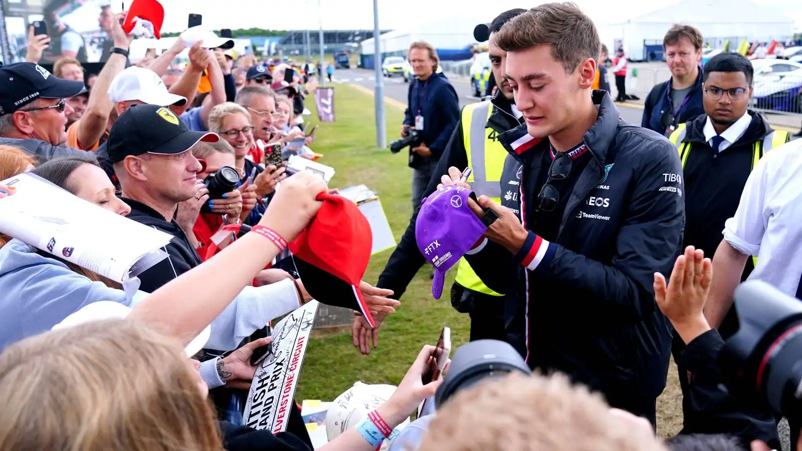 George Russell, Mercedes, interacts with fans at Silverstone. England, July 2022.