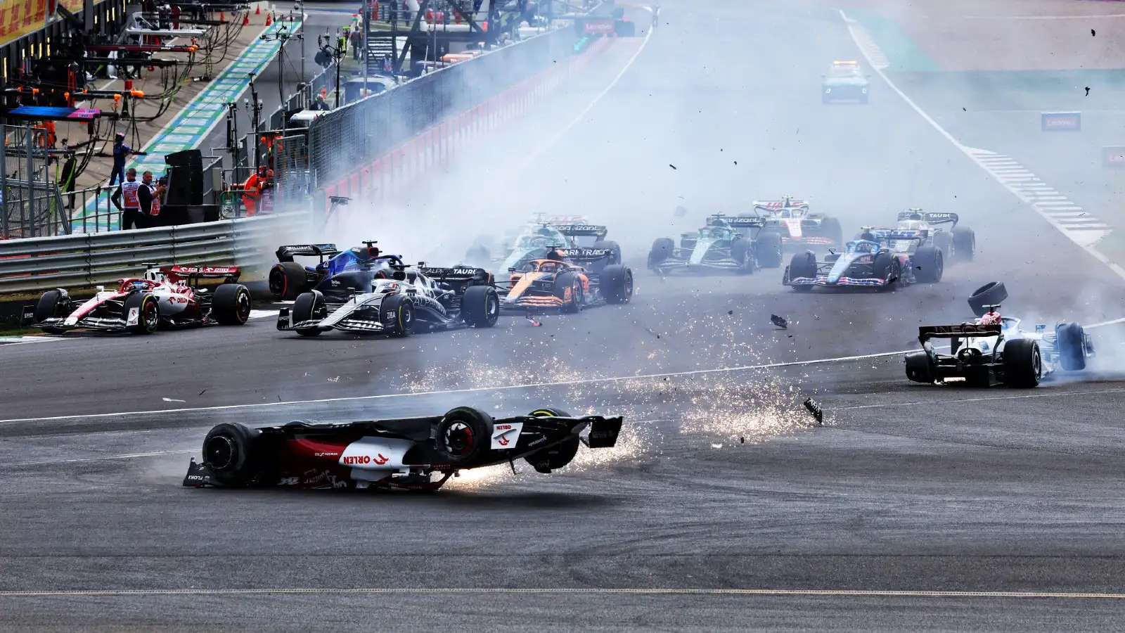 Alfa Romeo's Zhou Guanyu upside down at the first start for British Grand Prix. Silverstone, July 2022.