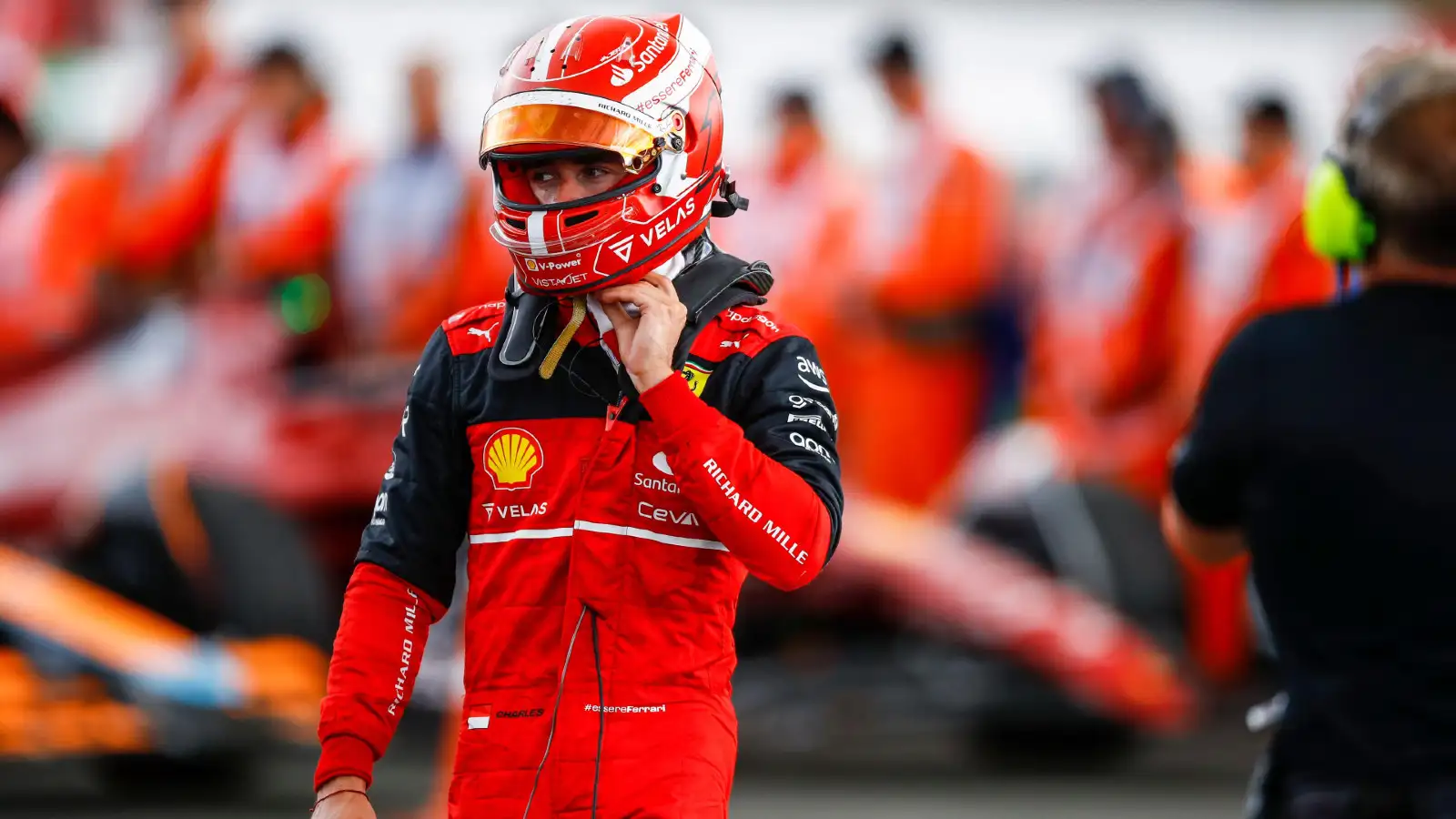 Ferrari's Charles Leclerc walks away from his car at the end of the British Grand Prix. Silverstone, July 2022.