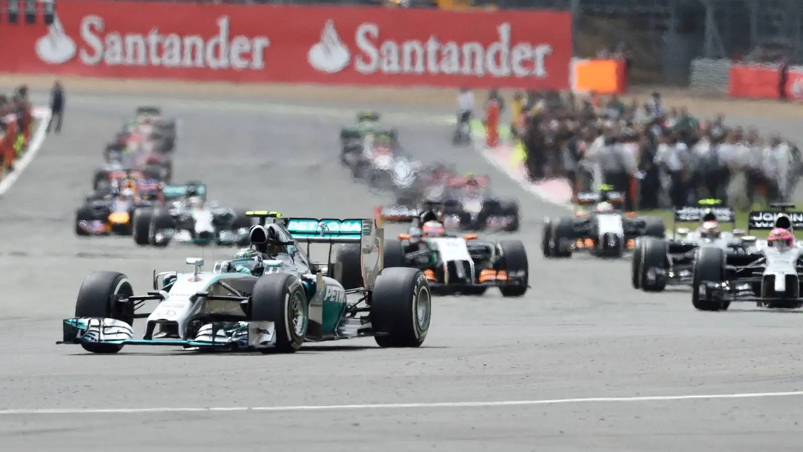 Cars pull away from Silverstone grid. England, July 2014.