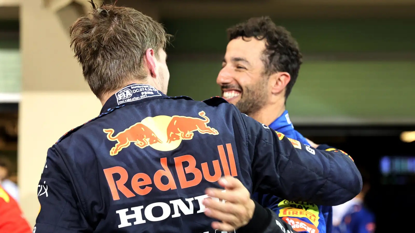 Race winner and World Champion Max Verstappen celebrates with Daniel Ricciardo in parc ferme. Abu Dhabi December 2021