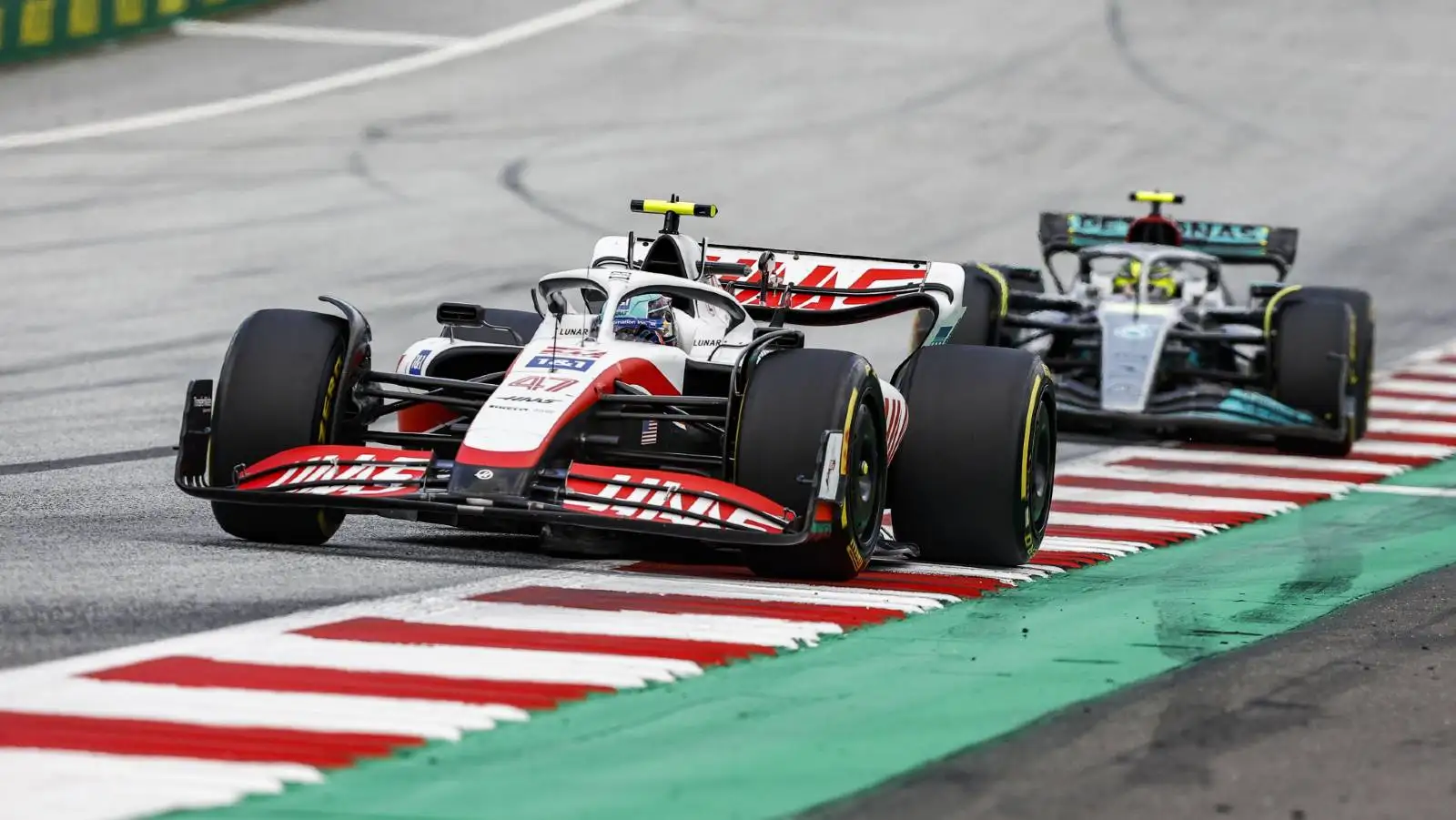 Mick Schumacher's Haas ahead of Lewis Hamilton's Mercedes. Red Bull Ring July 2022.