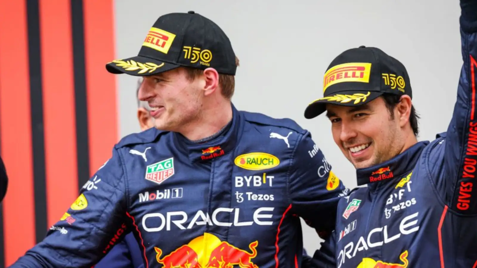 Max Verstappen and Sergio Perez smiling on the podium having finished 1-2. Imola April 2022