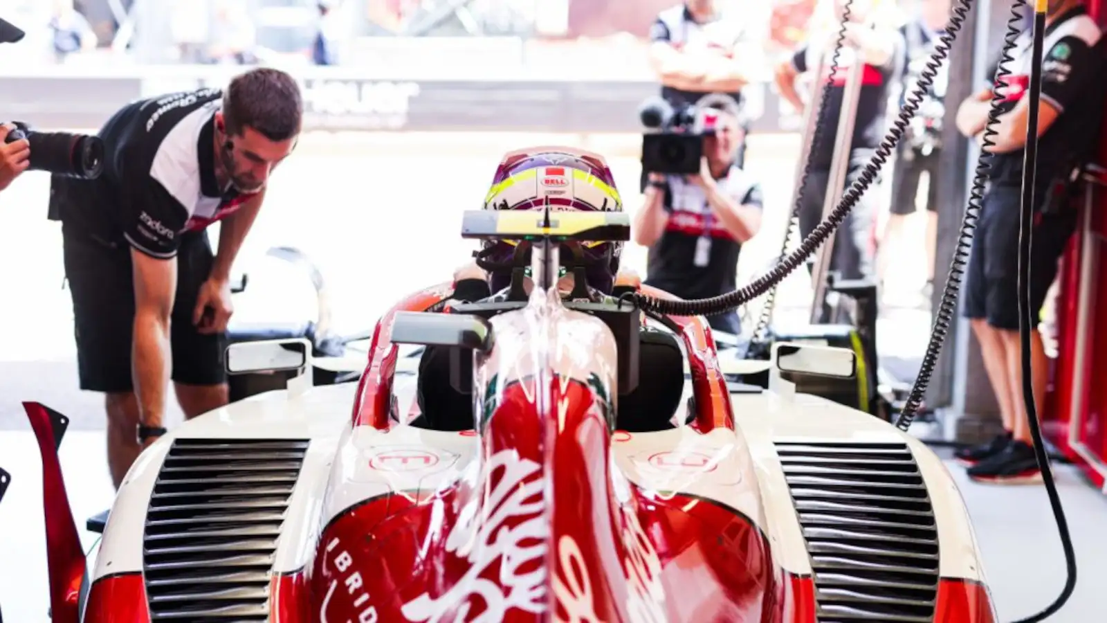 Zhou Guanyu sitting in his Alfa Romeo in the garage. Monaco May 2022