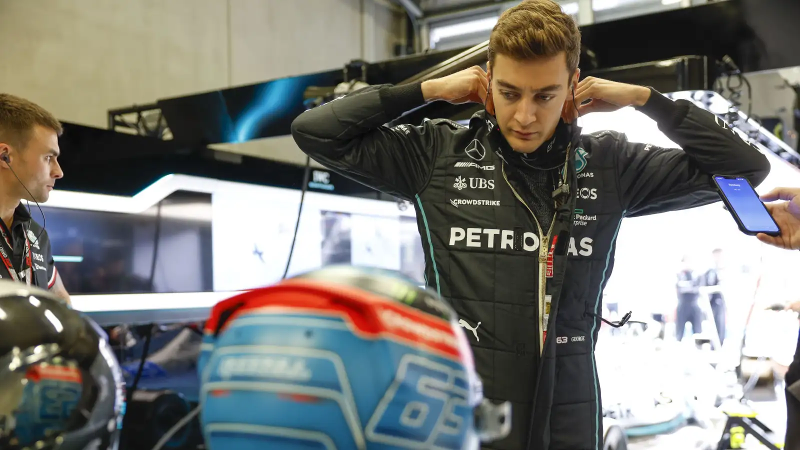 George Russell suiting up before climbing in the car. Austria qualifying July 2022