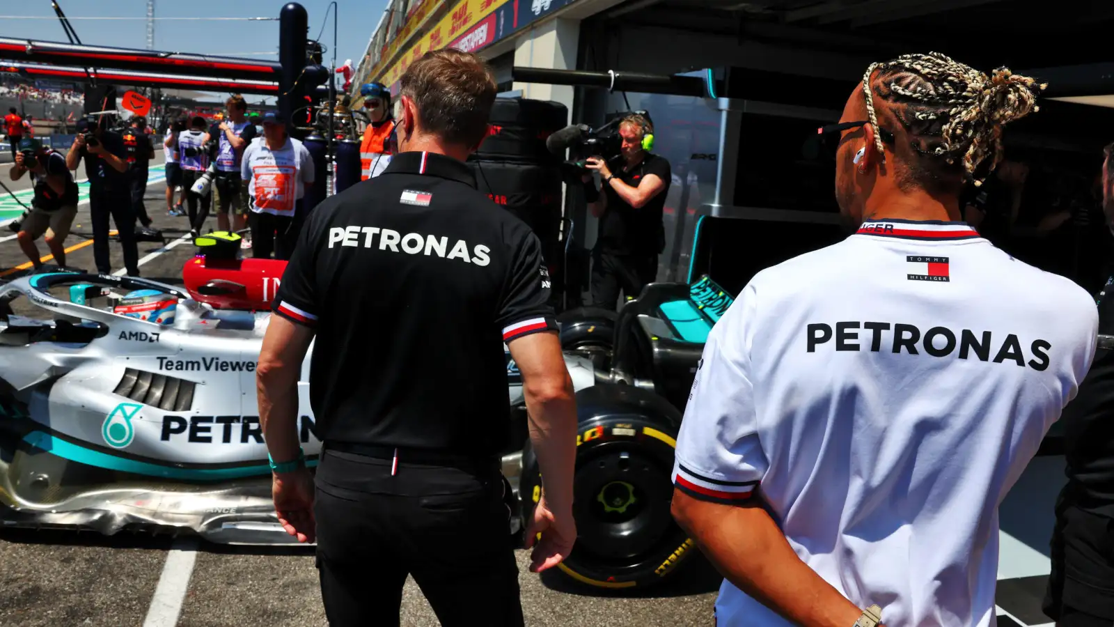 Lewis Hamilton watches Nyck de Vries leave the garage. France July 2022