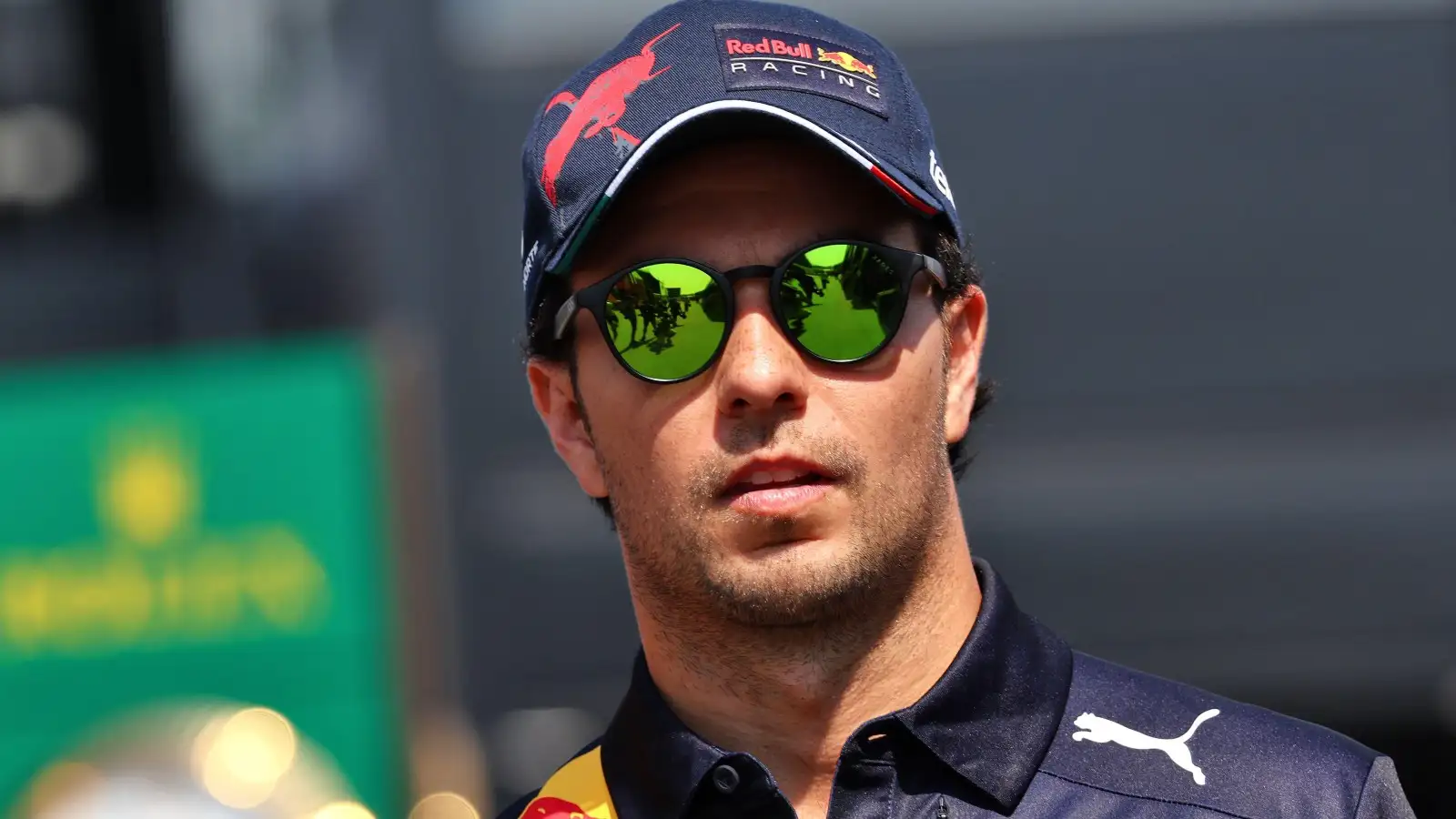 Sergio Perez wears Red Bull gear and sunglasses. France, July 2022.