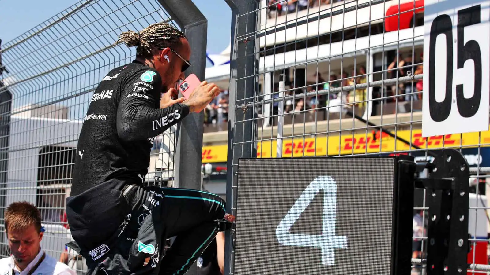 Lewis Hamilton jumps the pit wall. France July 2022.