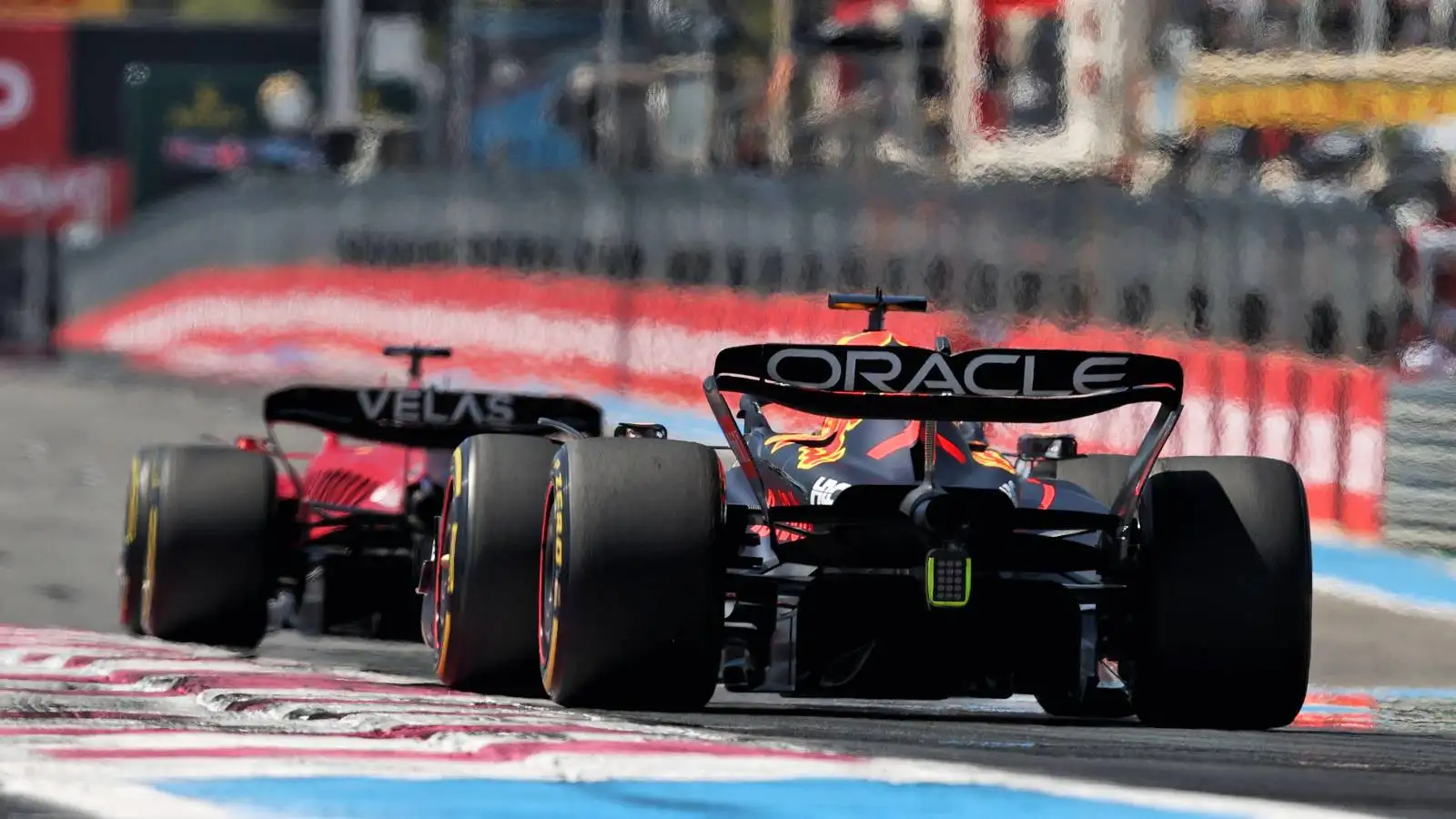 Max Verstappen, Red Bull, follows Charles Leclerc, Ferrari. France, July 2022.