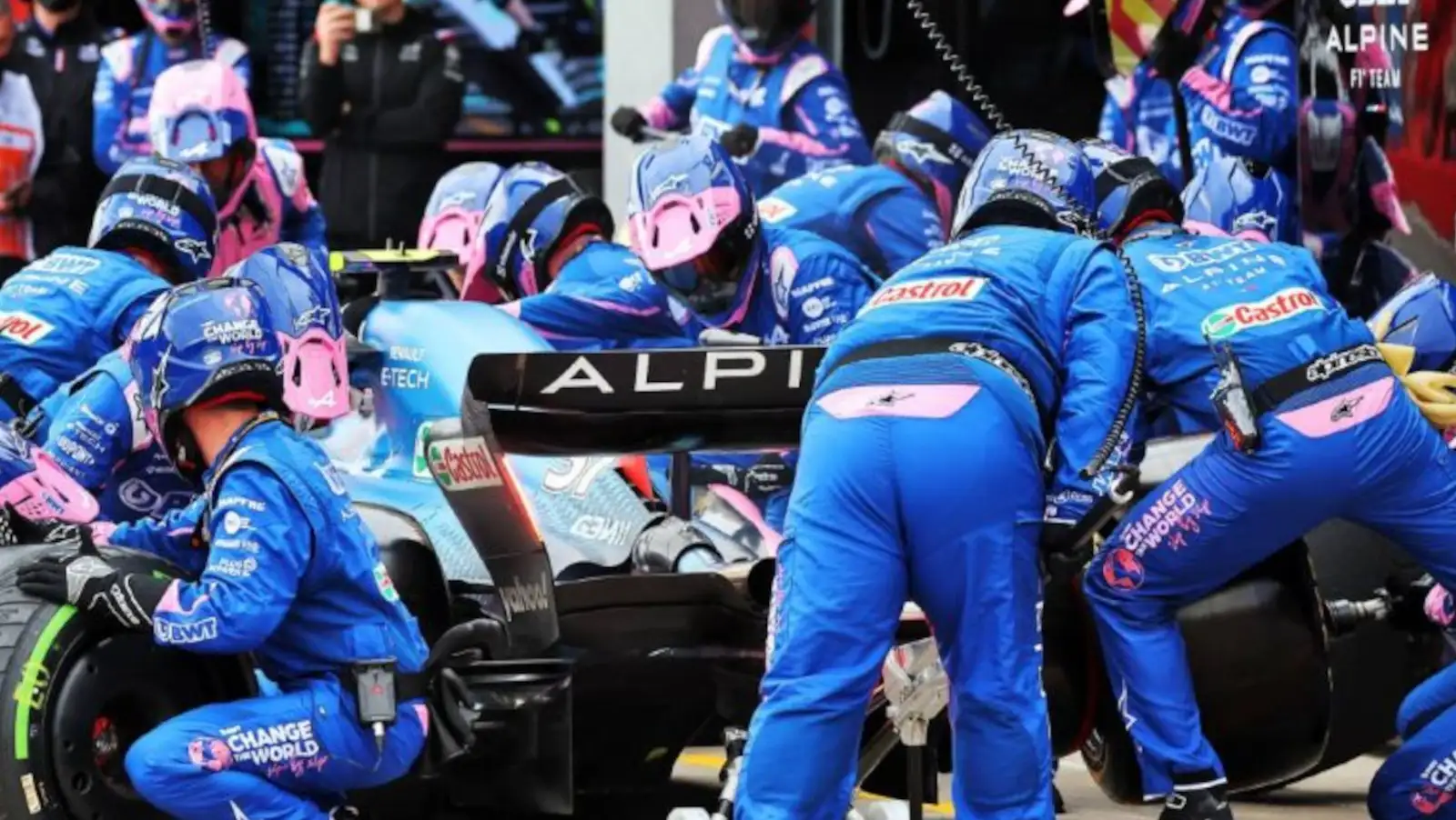 Esteban Ocon surrounded by his mechanics as he makes a pit stop. Imola April 2022