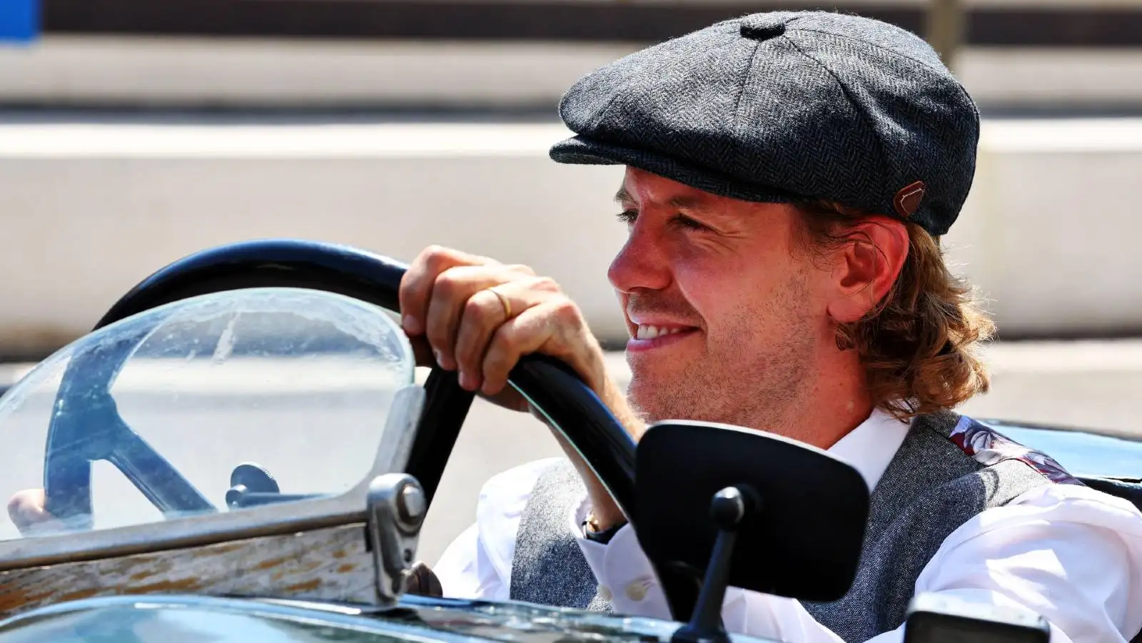 Sebastian Vettel at wheel of a 100yo Aston Martin. Paul Ricard July 2022.
