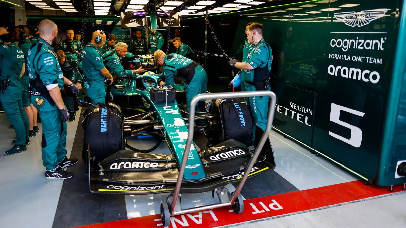 Aston Martin work on Sebastian Vettel's car. Miami May 2022.