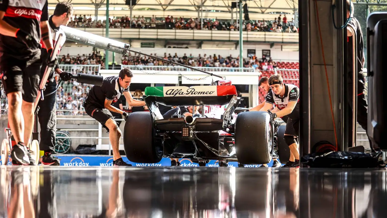 Valtteri Bottas' F1 Alfa Romeo being pushed into the garage. Hungaroring July 2022.