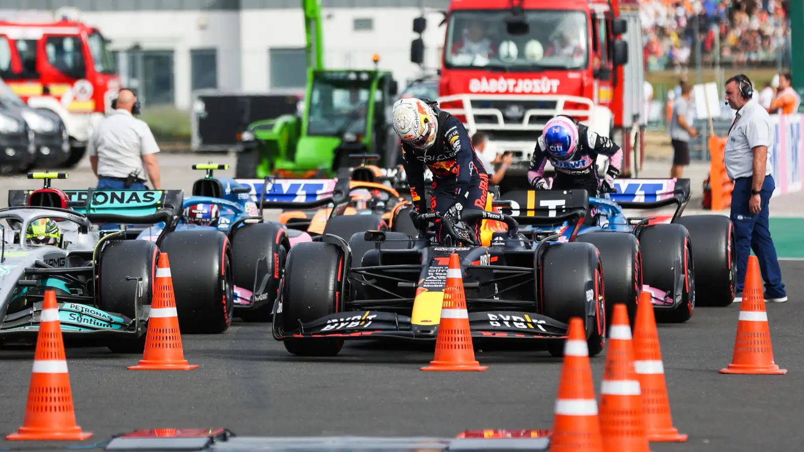 Max Verstappen climbs out of his RB18 in parc ferme. Hungary July 2022