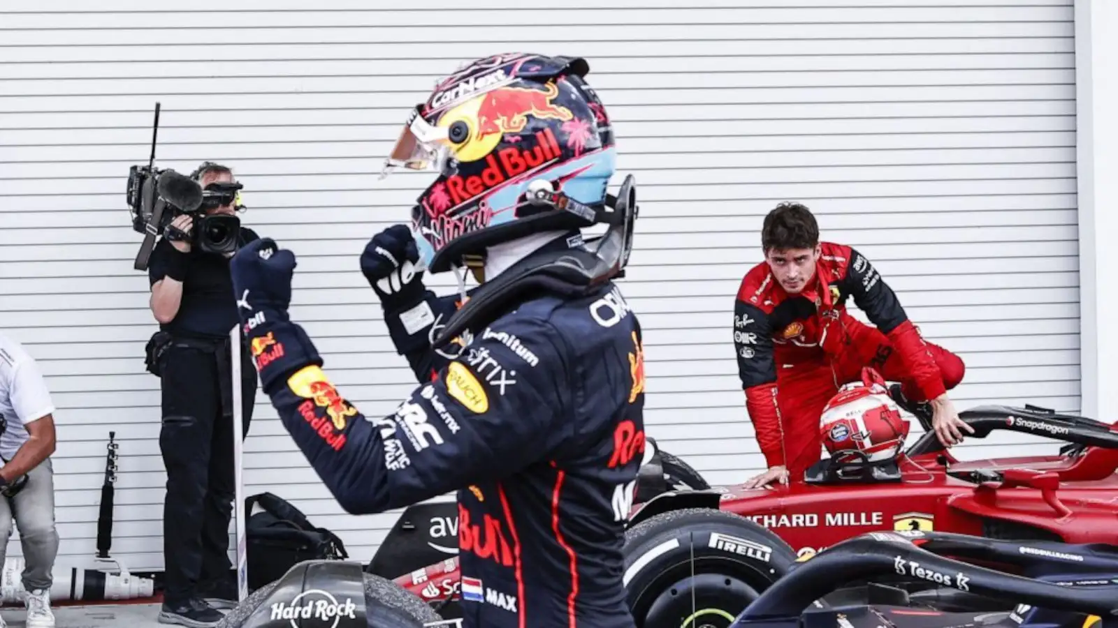 Max Verstappen celebrates as Charles Leclerc watches. Formula 1 Miami May 2022