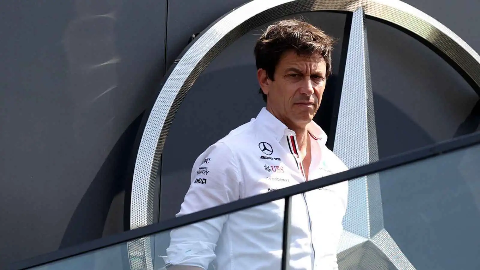 Mercedes team principal Toto Wolff on a balcony. Hungary July 2022.