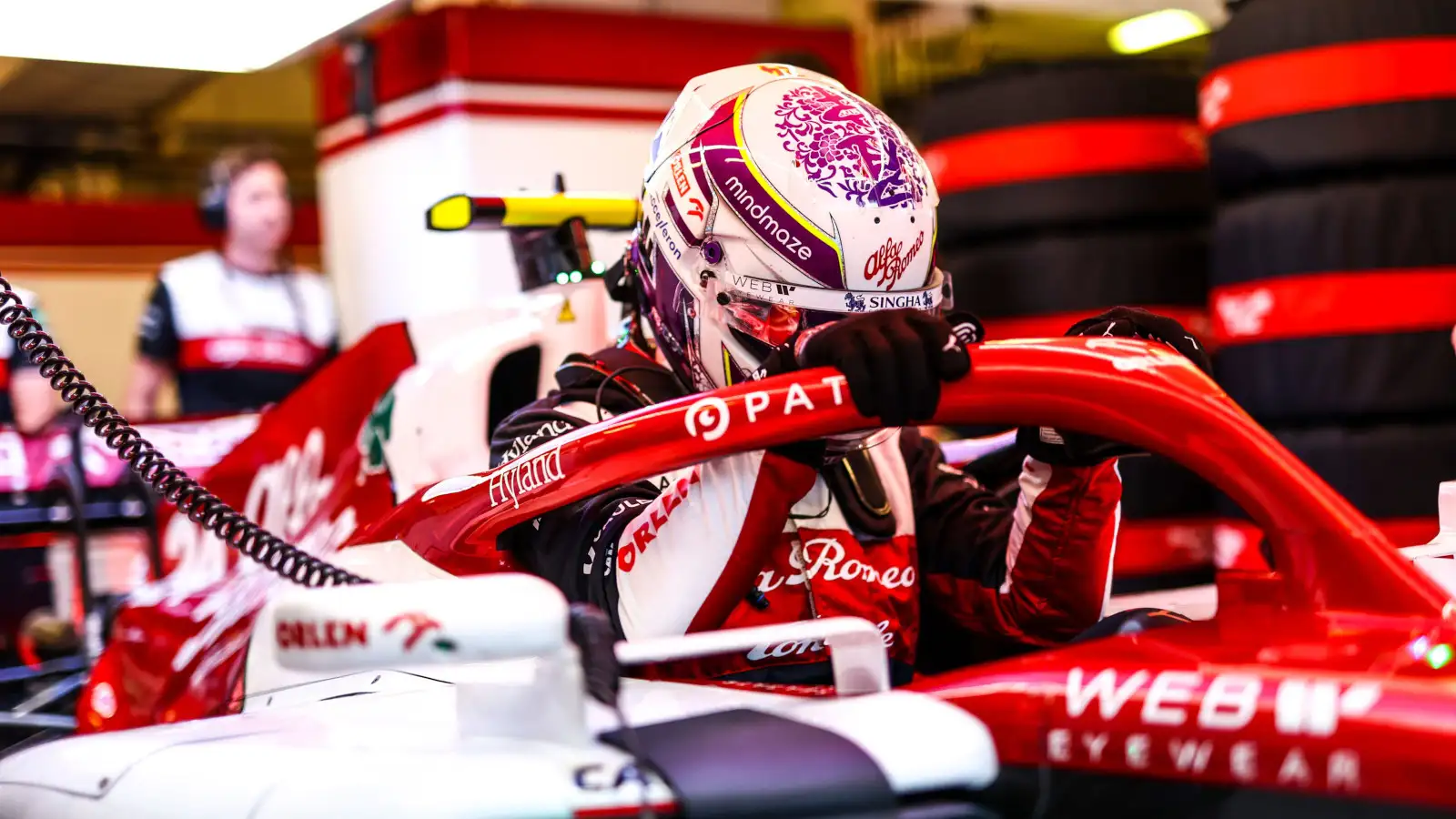 Zhou Guanyu climbs into his car. Hungary July 2022