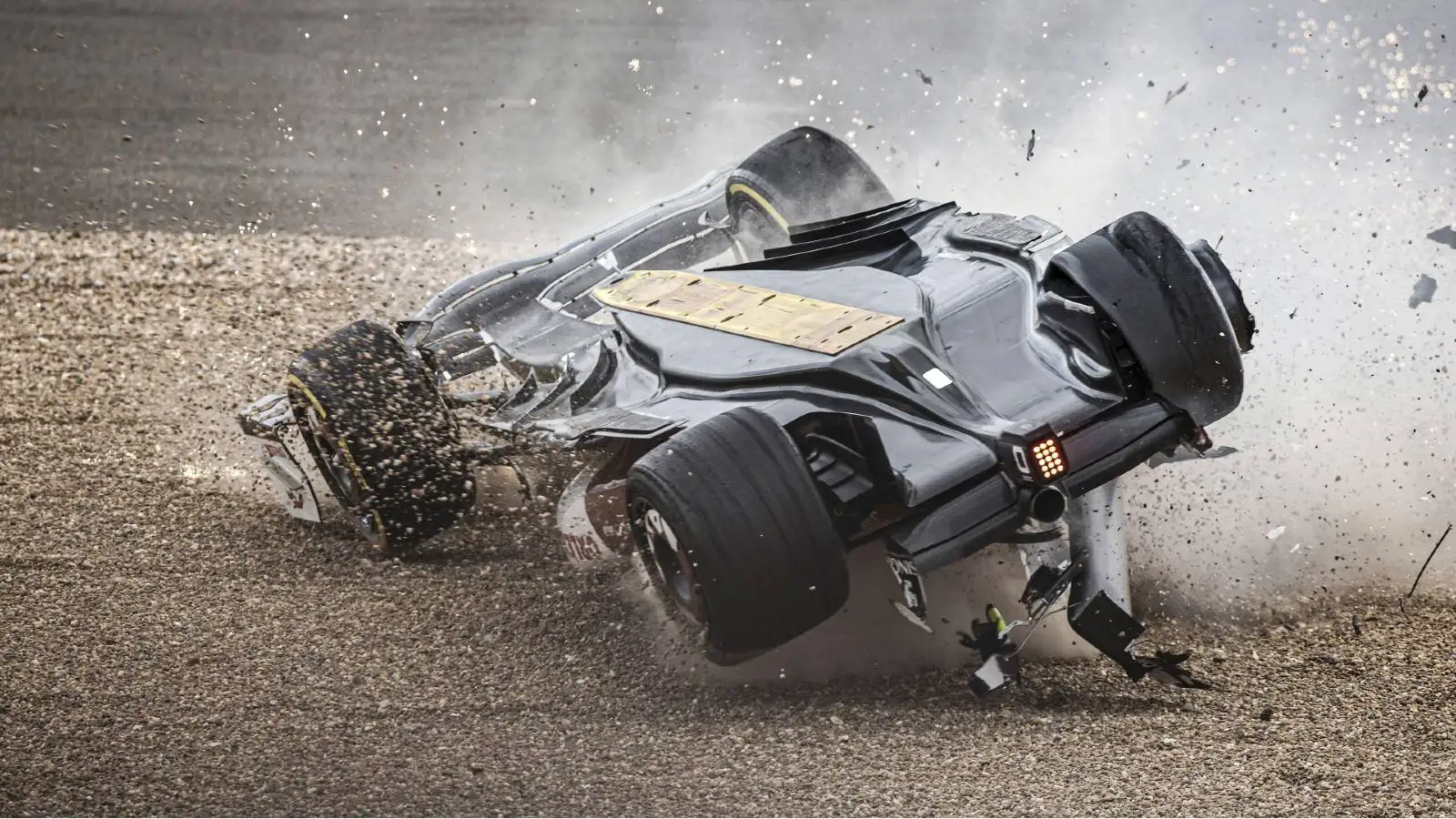 Zhou Guanyu's Alfa Romeo upside down in the gravel. Silverstone July 2022.