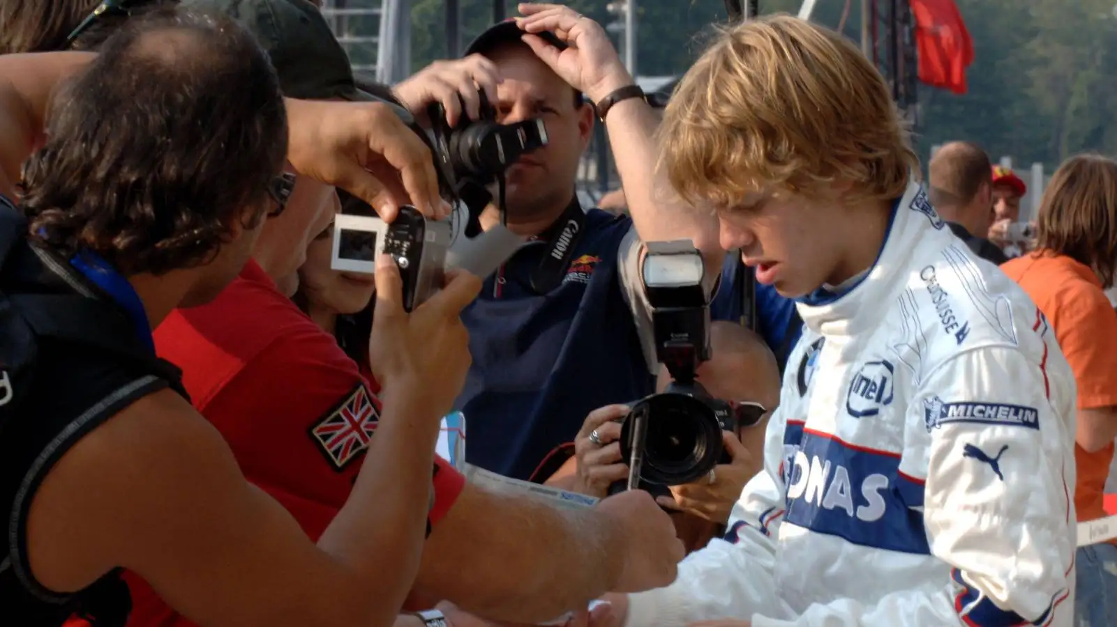 Sebastian Vettel signs autographs at the Italian GP. Monza September 2006.