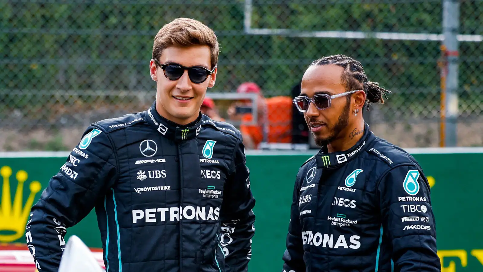 George Russell and Lewis Hamilton smiling and wearing sunglasses. Belgium August 2022