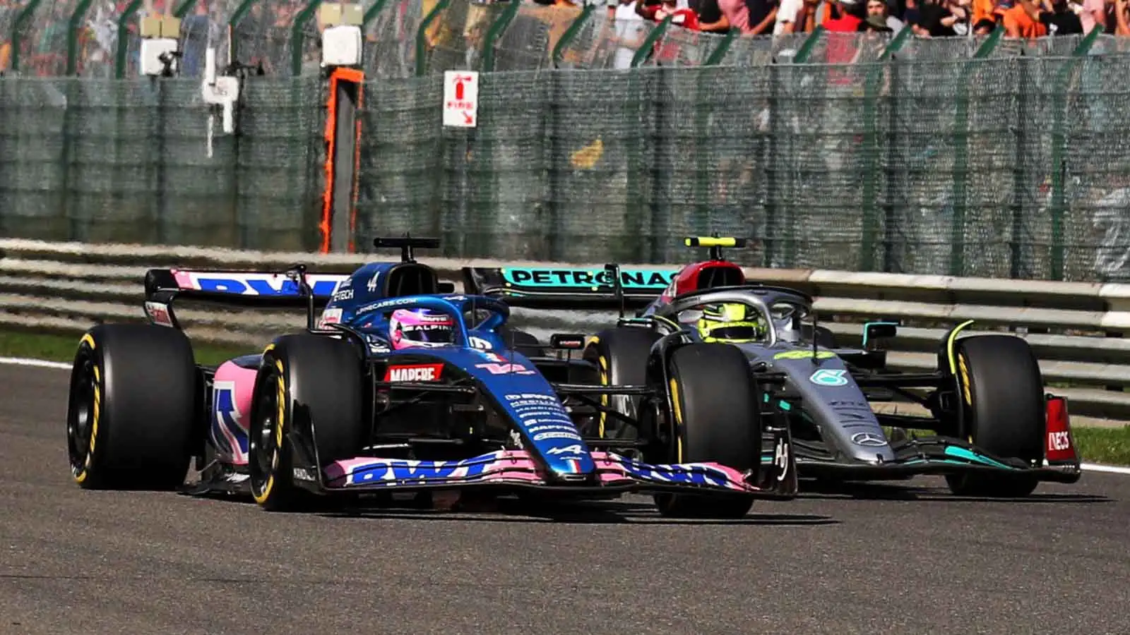 Lewis Hamilton alongside Fernando Alonso. Spa August 2022.