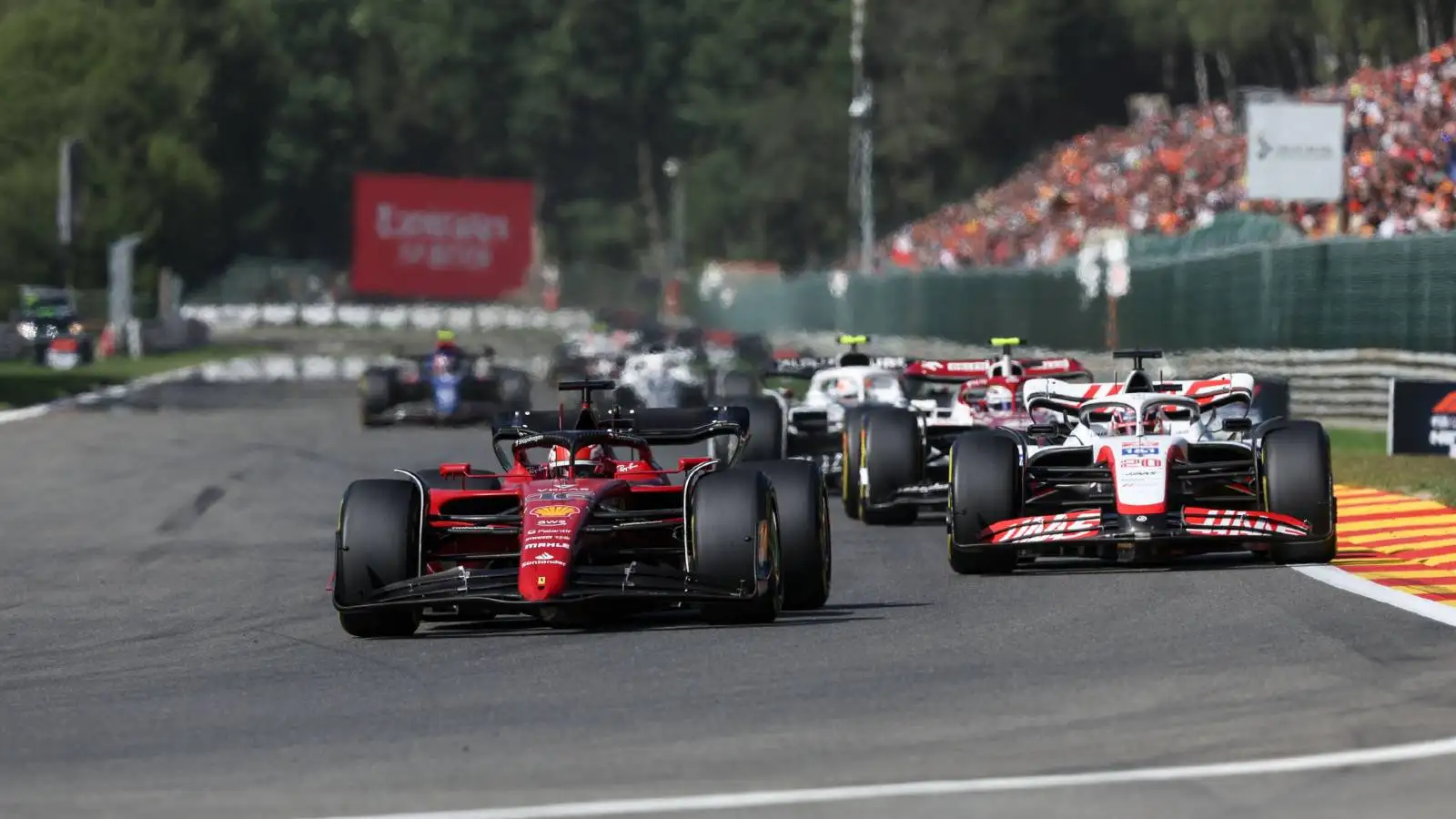 Charles Leclerc just ahead of a Haas. Spa-Francorchamps August 2022.