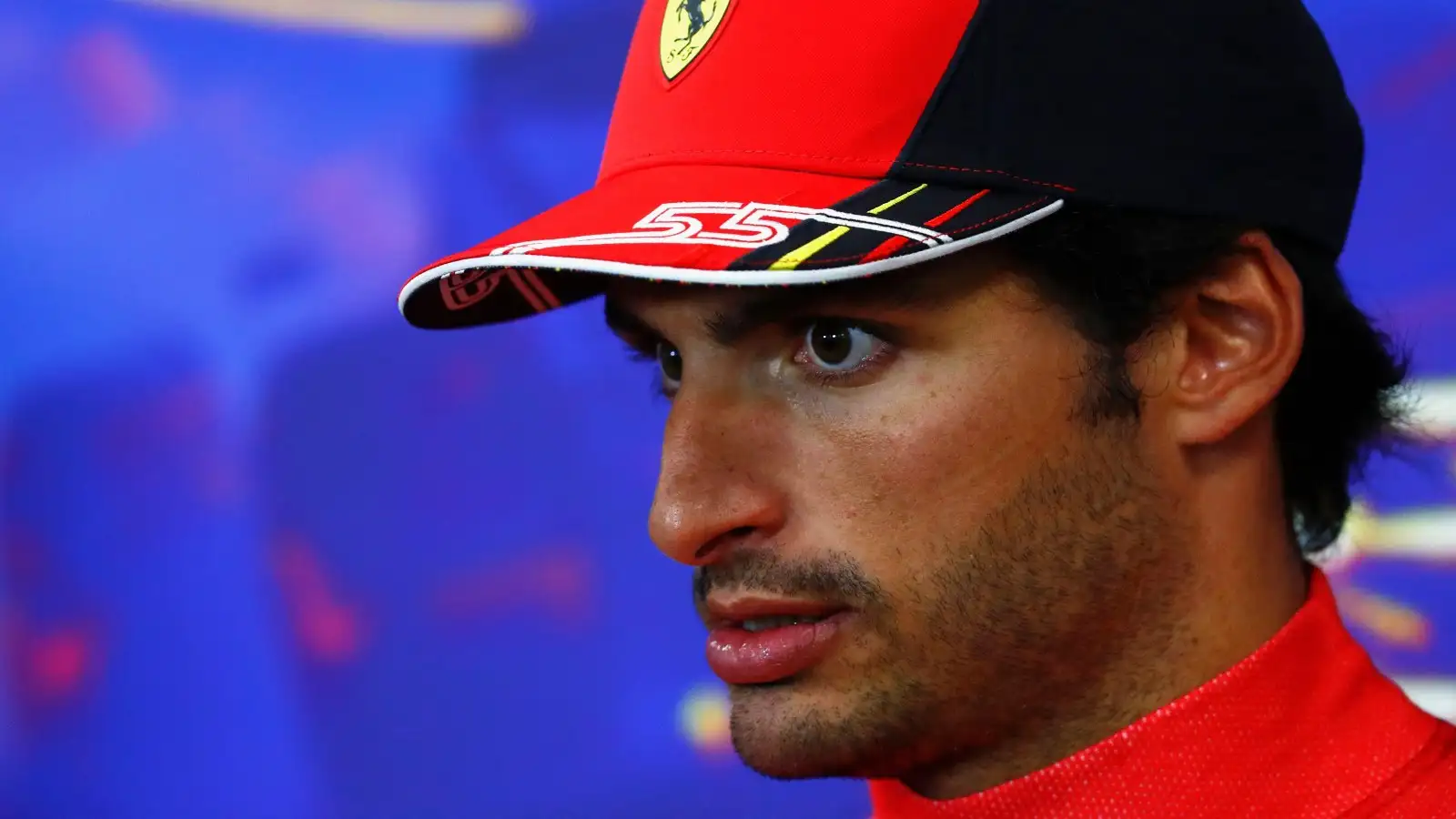 Carlos Sainz staring during a press conference. Spa, August 2022.