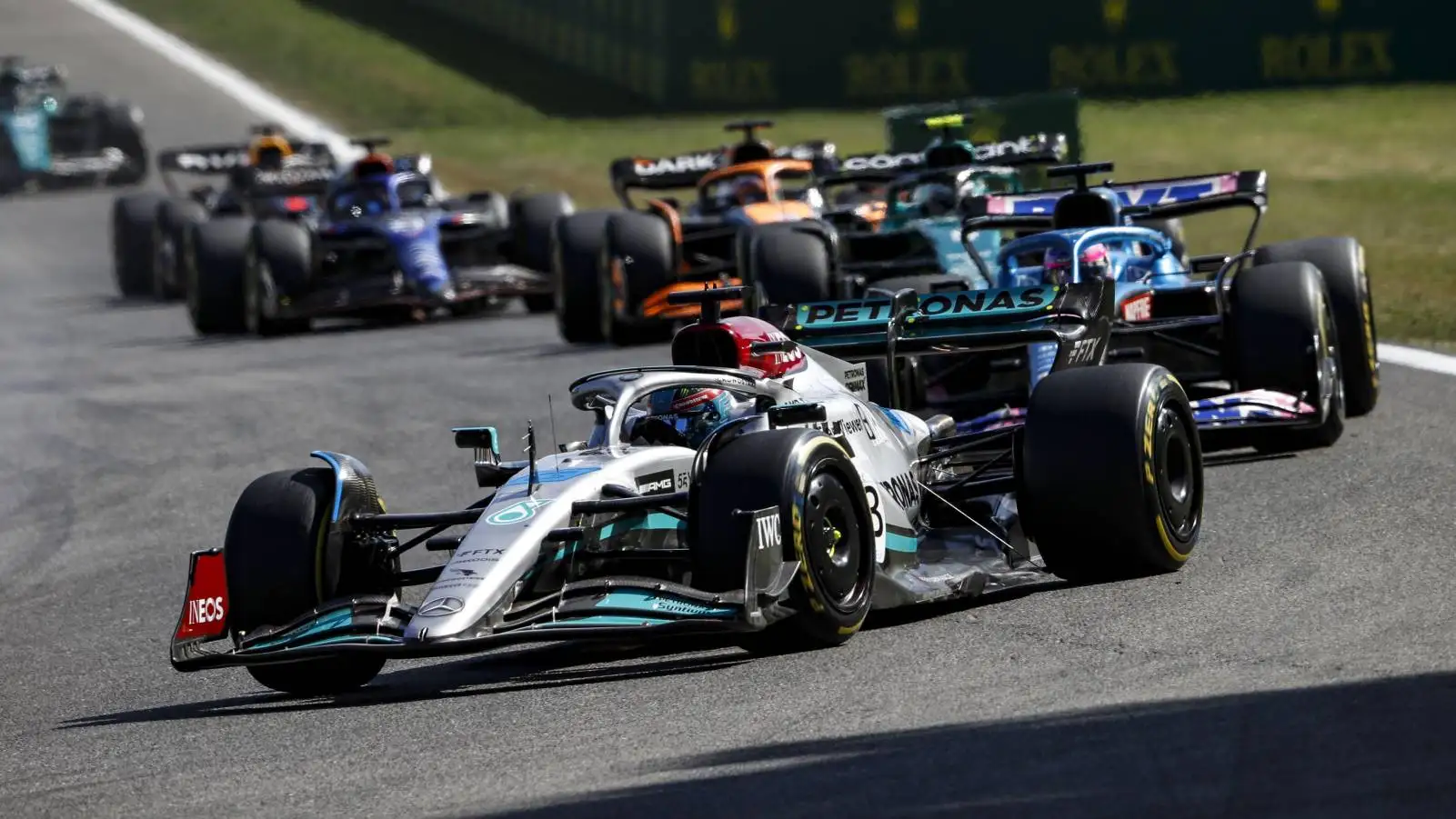 George Russell's Mercedes heads a train of cars. Spa-Francorchamps August 2022.